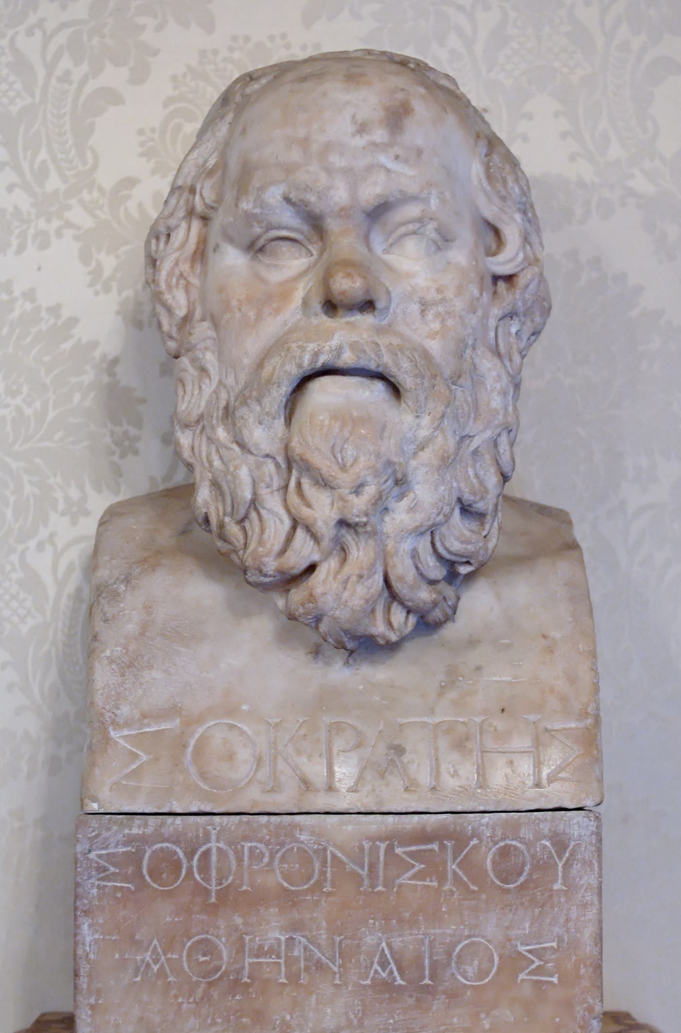 Marble herm of Socrates: a bald, bearded head on a pillar inscribed with his name in Greek